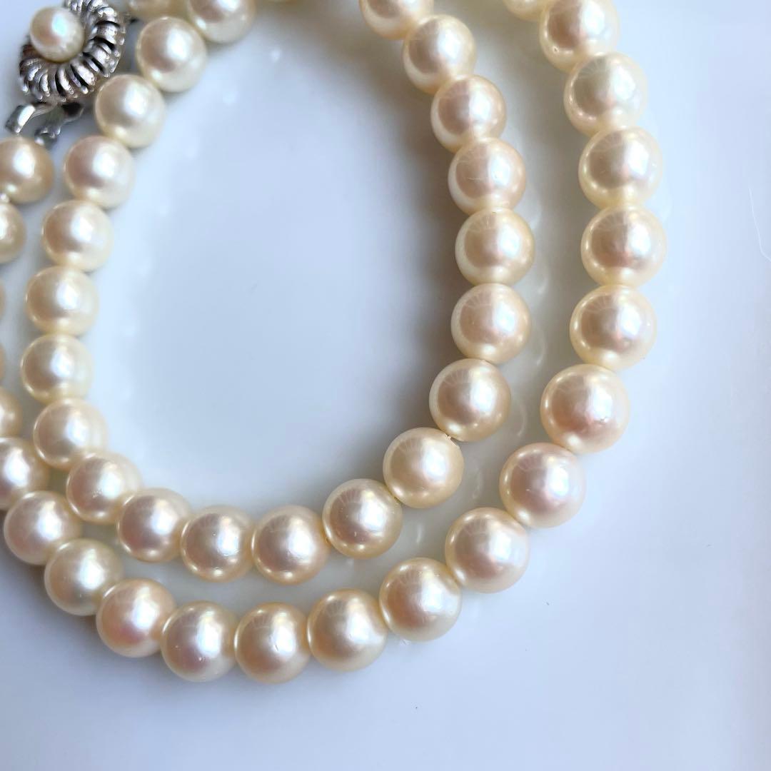 Akoya pearl necklace with 7.5-8mm white pearls and silver clasp displayed on a white background