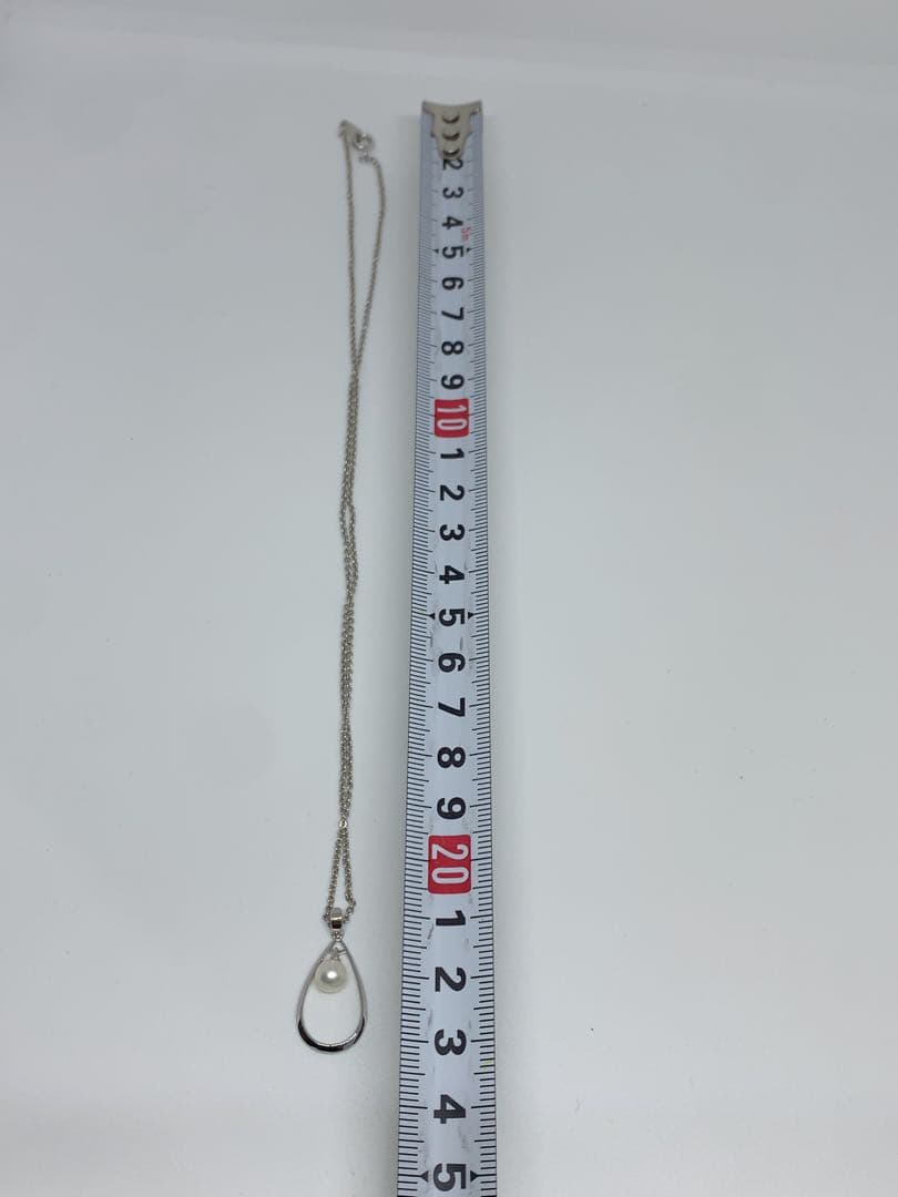 MIKIMOTO Akoya pearl necklace with silver chain, 45 cm long, displayed on white background