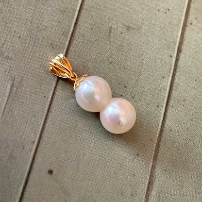 Lotus Law necklace featuring 6 mm genuine Akoya baroque pearls on 18K yellow gold chain 2 cm length