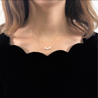 K18 18K gold necklace featuring three strands of 6.5mm Akoya pearls on a 40cm chain