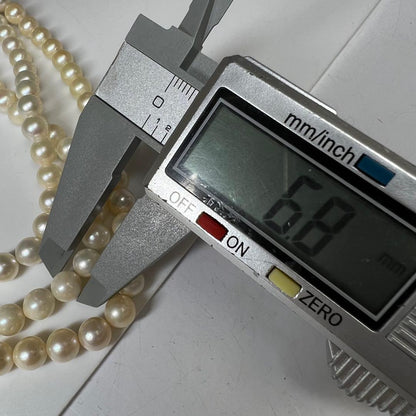 Three-strand Akoya pearl necklace with pearls measuring 6.8 to 6.9 cm in diameter
