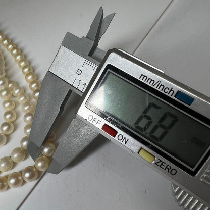 Three-strand Akoya pearl necklace with pearls measuring 6.8 to 6.9 cm in diameter