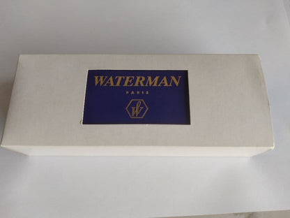 Waterman ballpoint pen in blue marble pattern with gold trim and twist mechanism, displayed with dedicated case