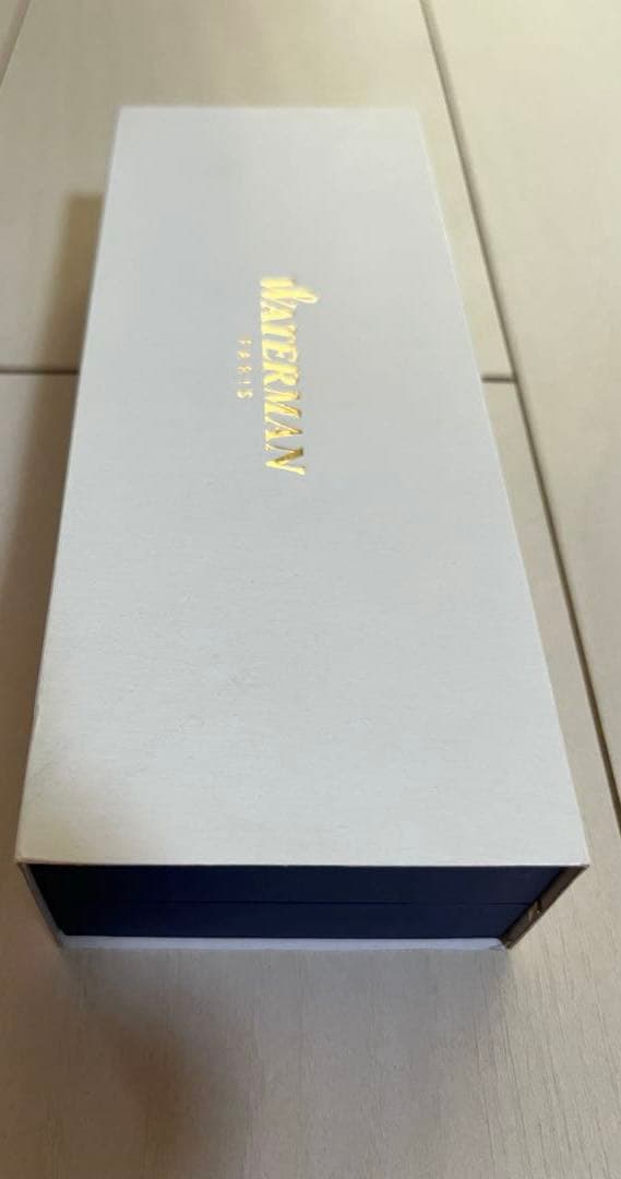 Silver Waterman ballpoint pen with sleek metallic finish shown with its outer box