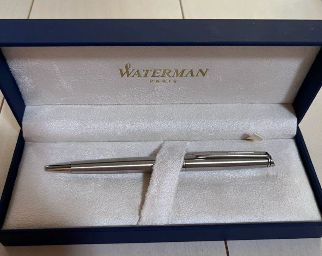 Silver Waterman ballpoint pen with sleek metallic finish shown with its outer box