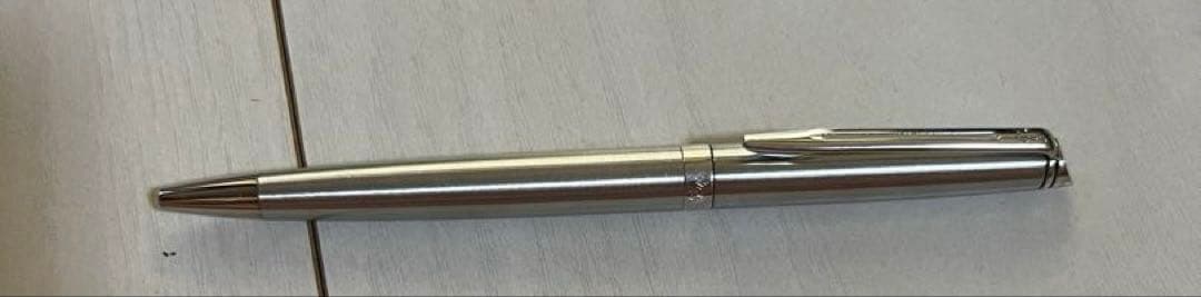 Silver Waterman ballpoint pen with sleek metallic finish shown with its outer box