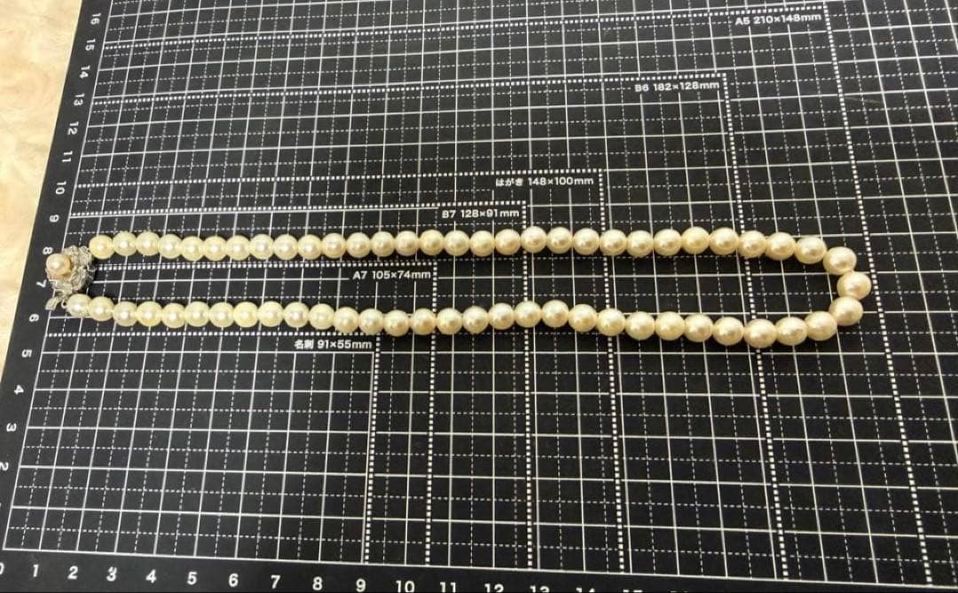 Honest Tsubamaki Akoya pearl necklace with 6.5mm pearls and strong shine on a white background