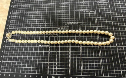 Honest Tsubamaki Akoya pearl necklace with 6.5mm pearls and strong shine on a white background