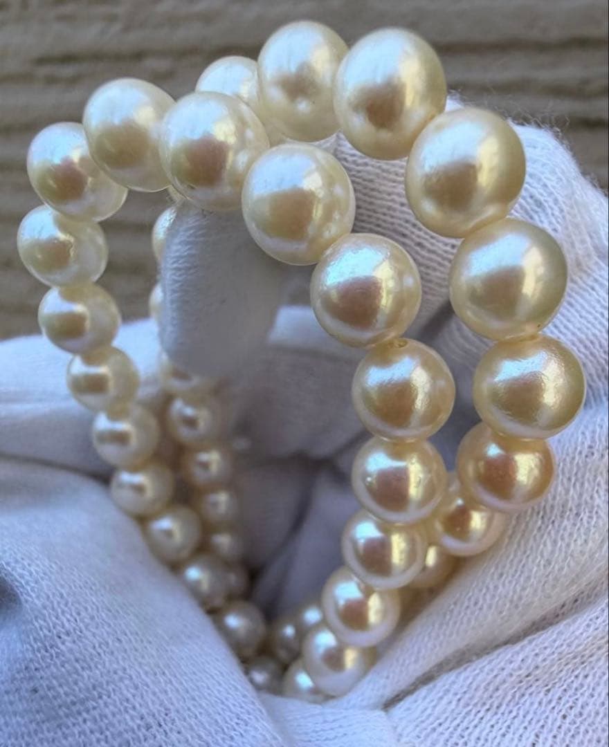 Honest Tsubamaki Akoya pearl necklace with 6.5mm pearls and strong shine on a white background