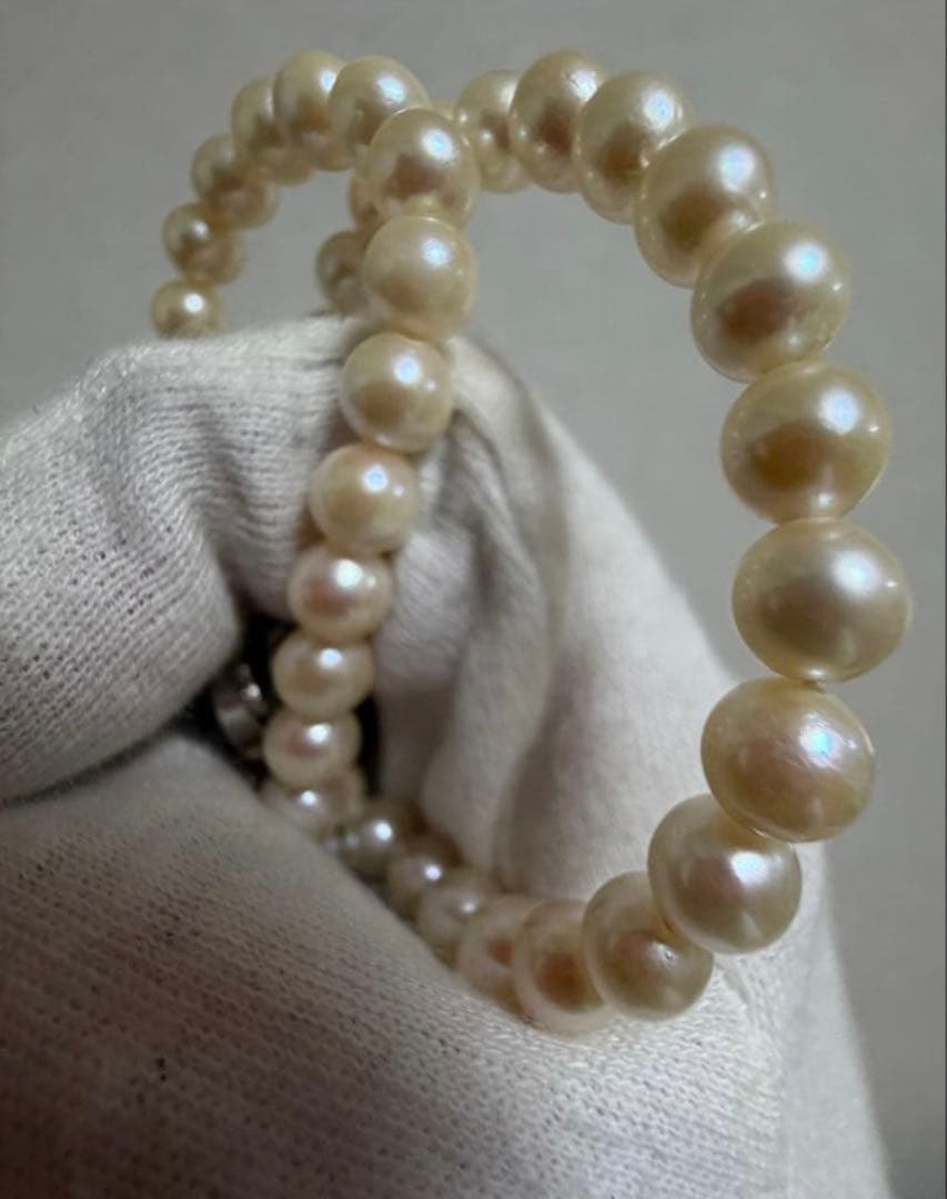 Honest Tsubamaki Akoya pearl necklace with 6.5mm pearls and strong shine on a white background