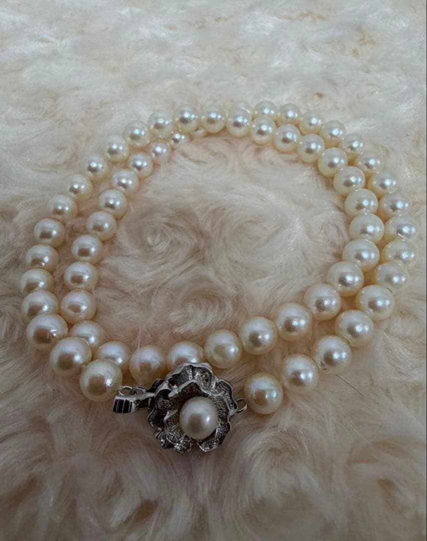 Honest Tsubamaki Akoya pearl necklace with 6.5mm pearls and strong shine on a white background