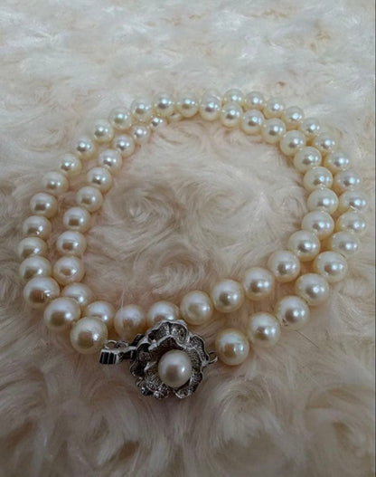 Honest Tsubamaki Akoya pearl necklace with 6.5mm pearls and strong shine on a white background
