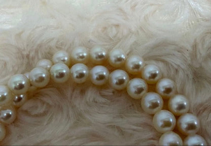Honest Tsubamaki Akoya pearl necklace with 6.5mm pearls and strong shine on a white background