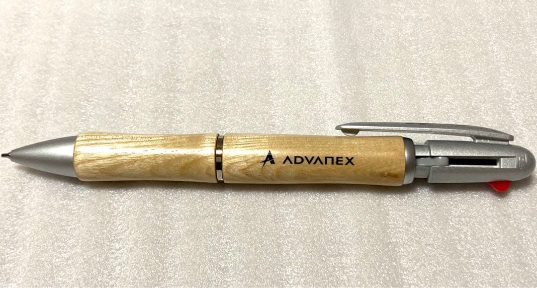 PILOT JustMeet wooden multi-function pen with three colors and mechanical pencil on a white background