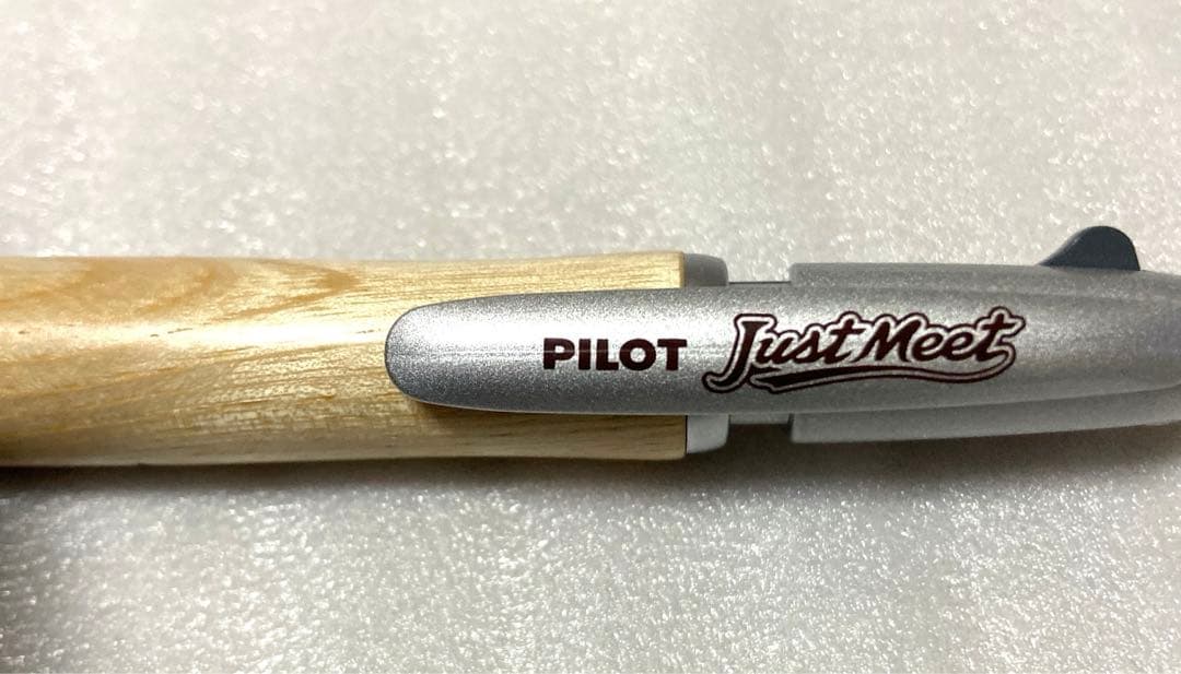 PILOT JustMeet wooden multi-function pen with three colors and mechanical pencil on a white background