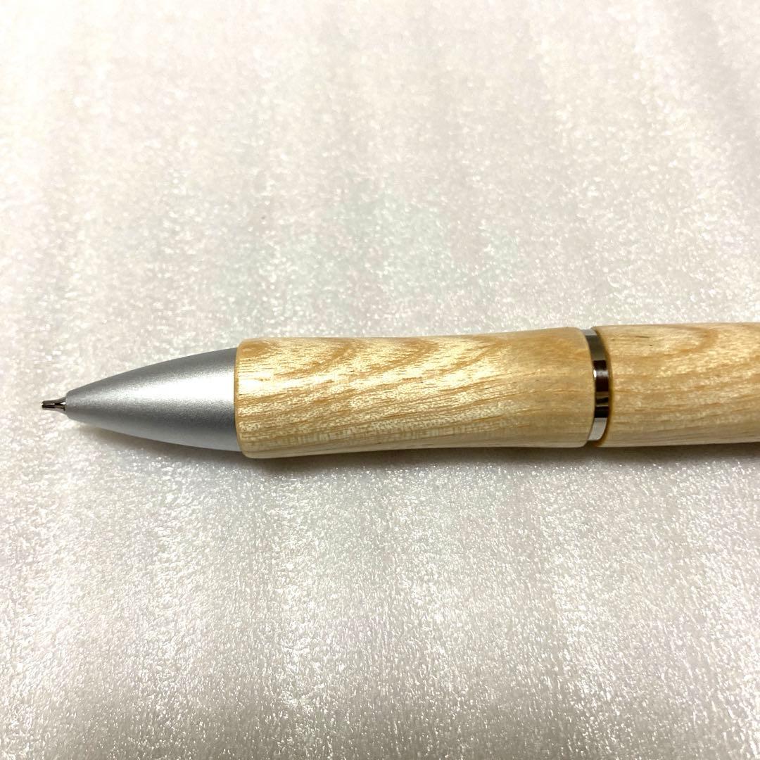 PILOT JustMeet wooden multi-function pen with three colors and mechanical pencil on a white background