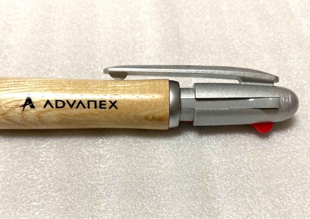 PILOT JustMeet wooden multi-function pen with three colors and mechanical pencil on a white background