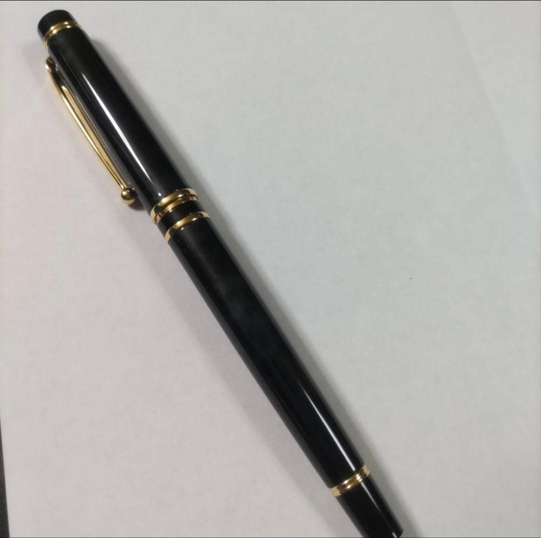 New Pilot Graice fountain pen in black and gold with 14k gold nib shown uncapped and writing