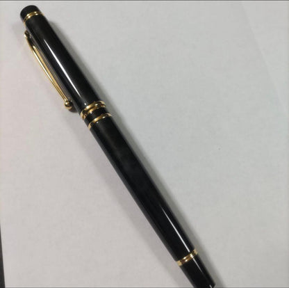 New Pilot Graice fountain pen in black and gold with 14k gold nib shown uncapped and writing