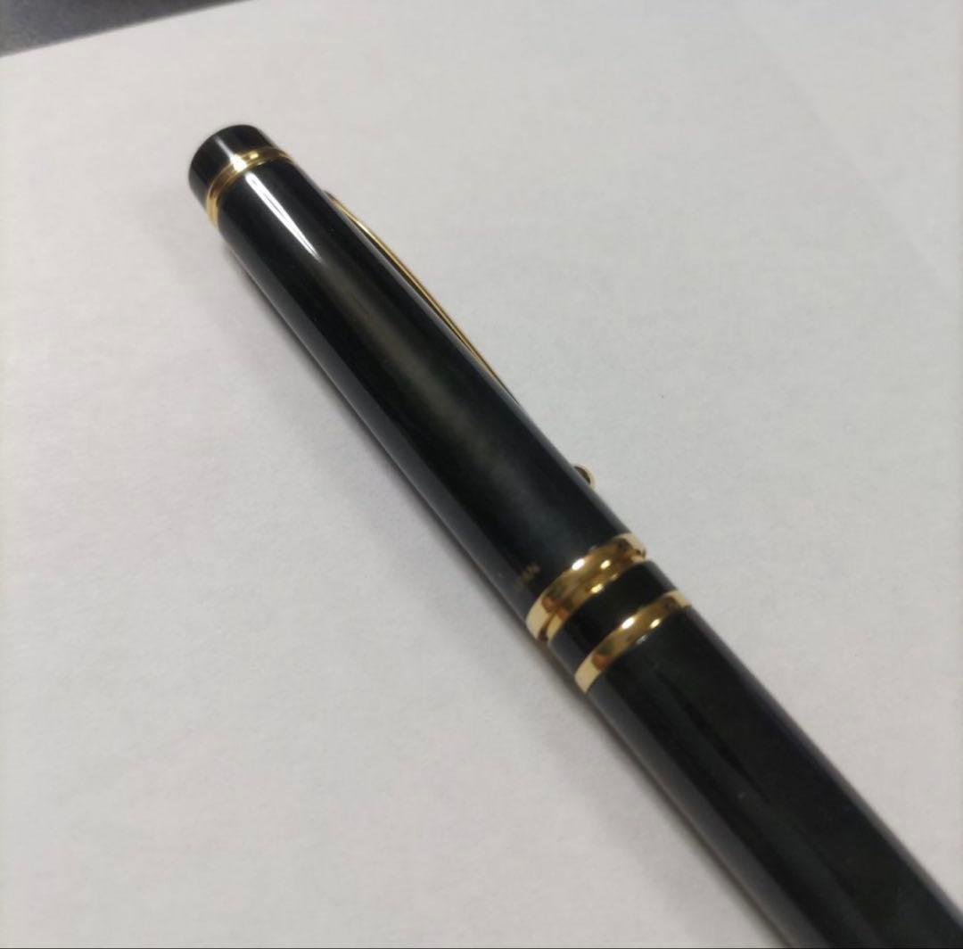New Pilot Graice fountain pen in black and gold with 14k gold nib shown uncapped and writing