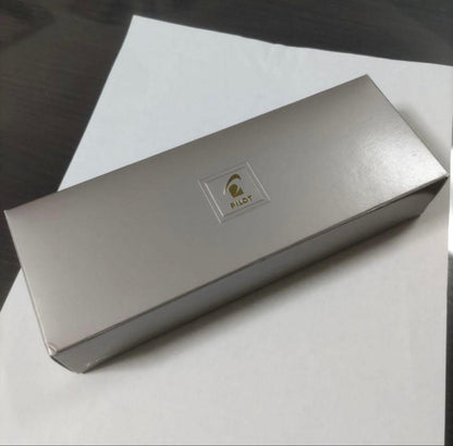 New Pilot Graice fountain pen in black and gold with 14k gold nib shown uncapped and writing