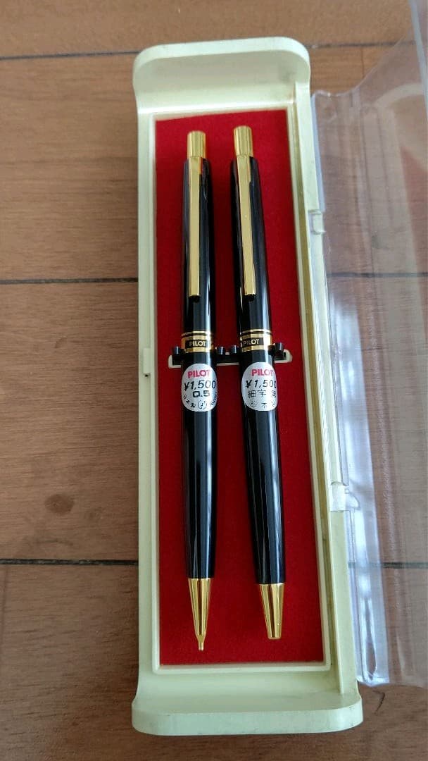 Pilot mechanical pencil and ballpoint pen set in a dedicated case showing pencil and pen with black ink