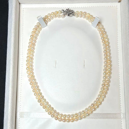 Two-strand Akoya pearl necklace featuring baby pearls sized 5.0-5.4mm, 41 cm length