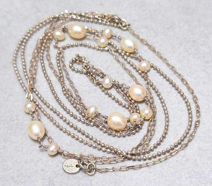 Agete pearl necklace featuring two silver925 strands with pearls, approximately 82 cm long