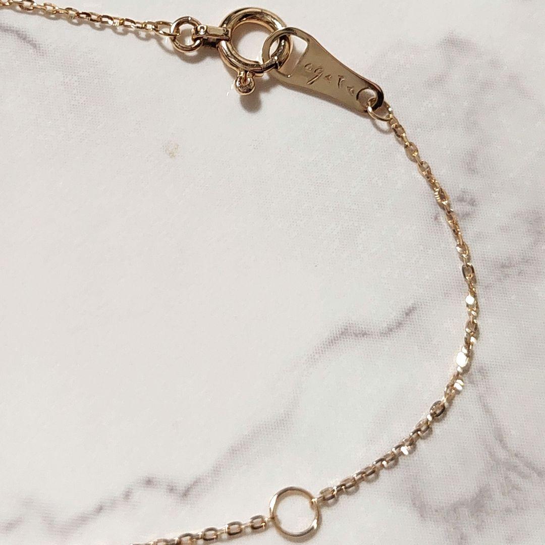 Current Model Agate K10 necklace with opal pendant measuring 0.6 by 0.4 cm on 40 cm gold chain