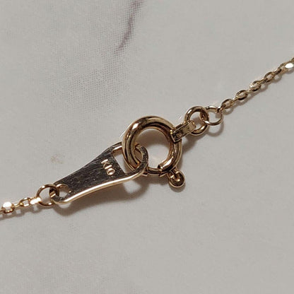 Current Model Agate K10 necklace with opal pendant measuring 0.6 by 0.4 cm on 40 cm gold chain