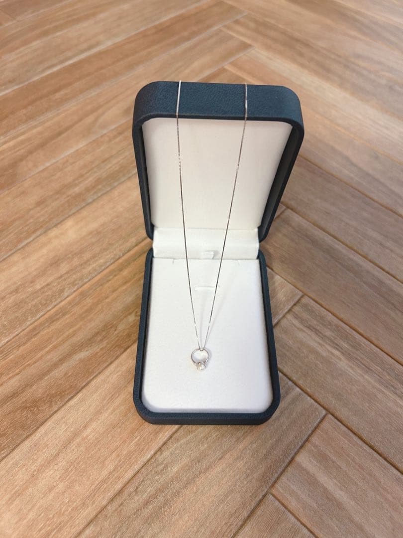 Baby Ring with Akoya Pearl on a 40cm platinum necklace chain