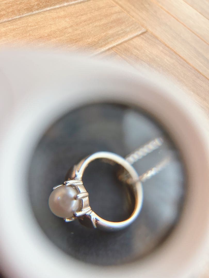 Baby Ring with Akoya Pearl on a 40cm platinum necklace chain