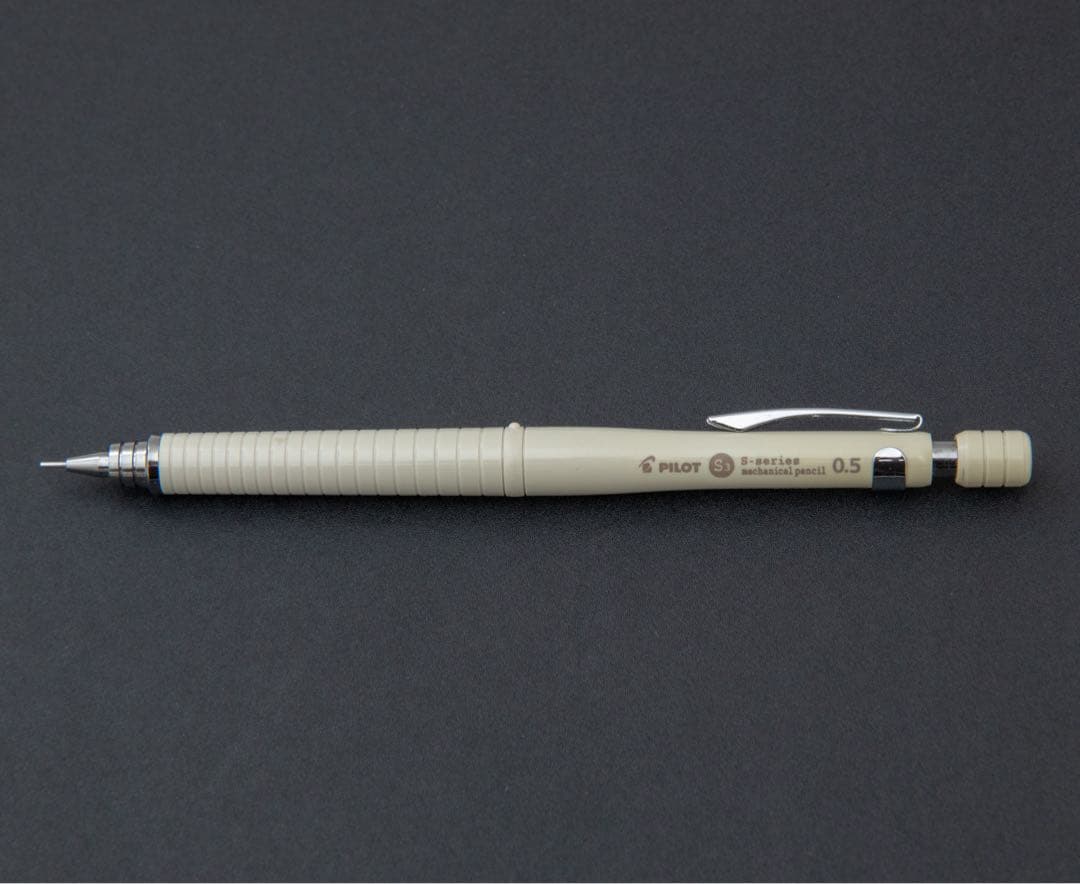 Used Pilot S3 mechanical pencil in ivory color with 0.5mm lead size stored in dark place