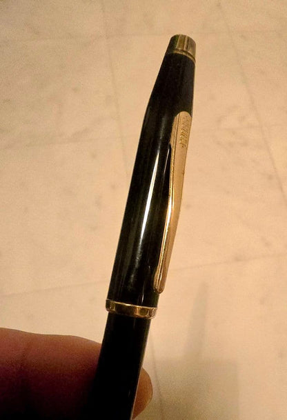 Cross ballpoint pen with black body and gold trim classic century design