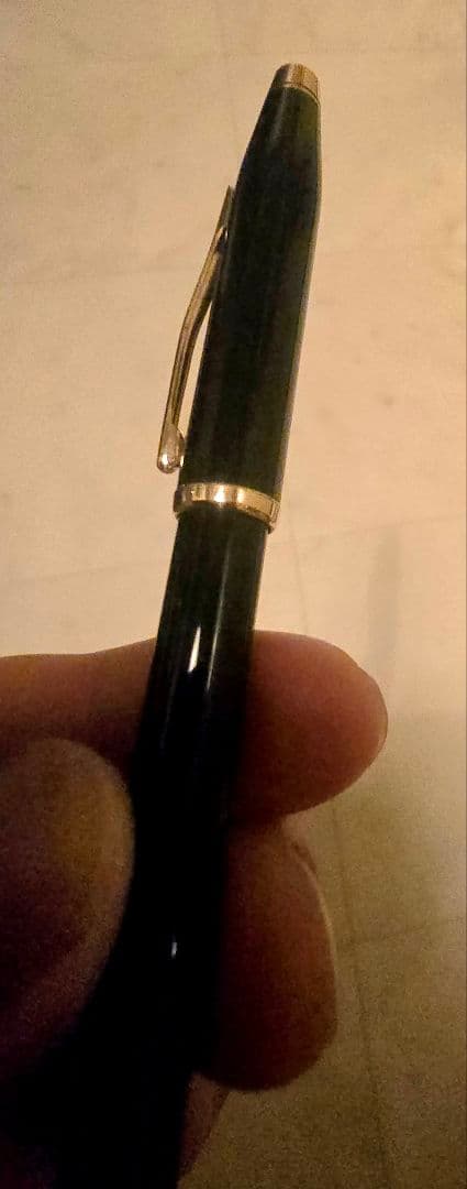 Cross ballpoint pen with black body and gold trim classic century design