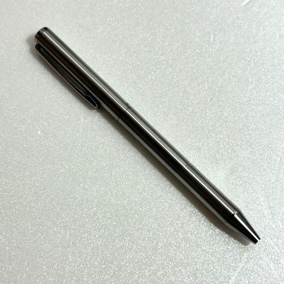 Discontinued Pilot Twist ballpoint pen in silver with two color ink mechanism, used condition