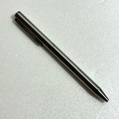 Discontinued Pilot Twist ballpoint pen in silver with two color ink mechanism, used condition