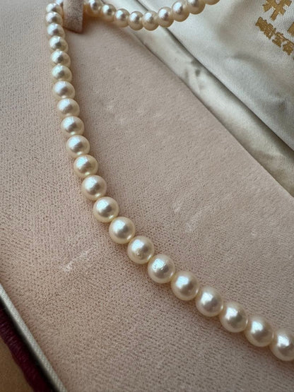 Small pearl necklace featuring 60 round Akoya pearls sized 6.8mm on a 42cm strand