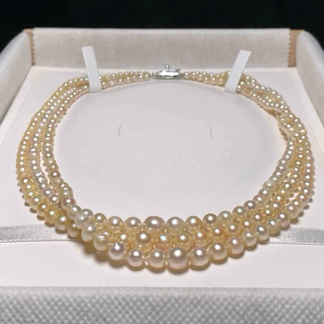 Akoya pearl triple gradient necklace with 3.4-7.3mm white semi-round pearls, 42.7cm length, silver imprint
