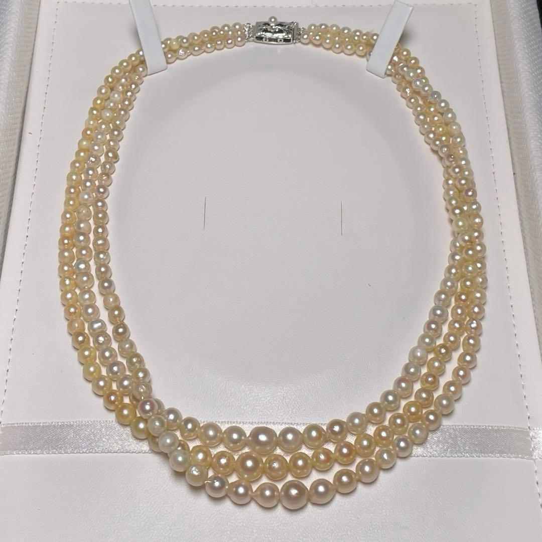 Akoya pearl triple gradient necklace with 3.4-7.3mm white semi-round pearls, 42.7cm length, silver imprint