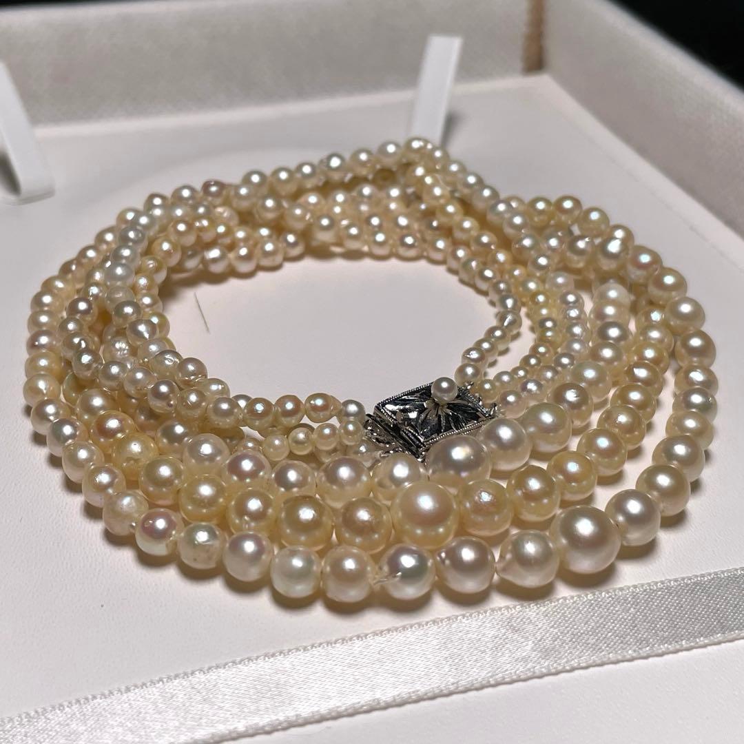 Akoya pearl triple gradient necklace with 3.4-7.3mm white semi-round pearls, 42.7cm length, silver imprint