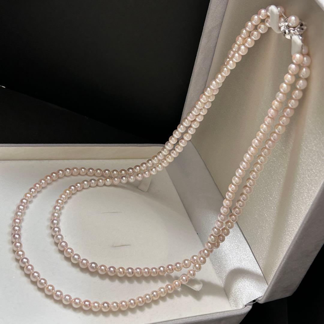 Long Akoya pearl necklace with 6.5mm pink pearls measuring 124cm with sterling silver details