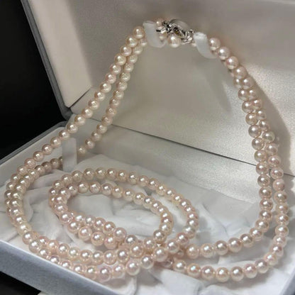 Long Akoya pearl necklace with 6.5mm pink pearls measuring 124cm with sterling silver details