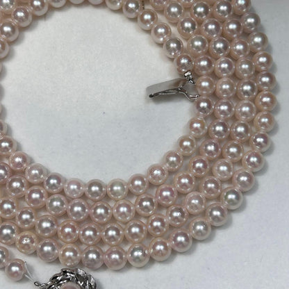 Long Akoya pearl necklace with 6.5mm pink pearls measuring 124cm with sterling silver details