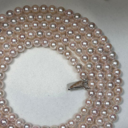 Long Akoya pearl necklace with 6.5mm pink pearls measuring 124cm with sterling silver details