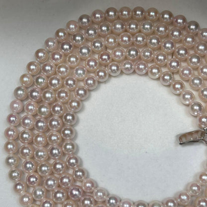 Long Akoya pearl necklace with 6.5mm pink pearls measuring 124cm with sterling silver details