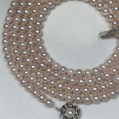 Long Akoya pearl necklace with 6.5mm pink pearls measuring 124cm with sterling silver details