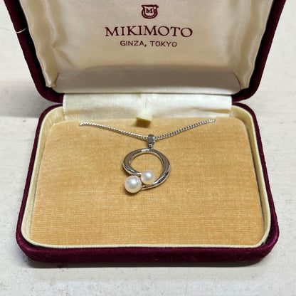 MIKIMOTO pearl necklace in silver color with 24 cm length displayed on a white background