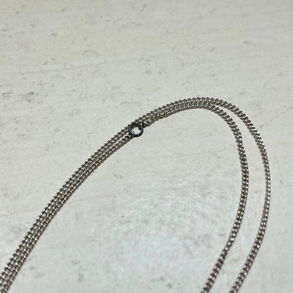 MIKIMOTO pearl necklace in silver color with 24 cm length displayed on a white background