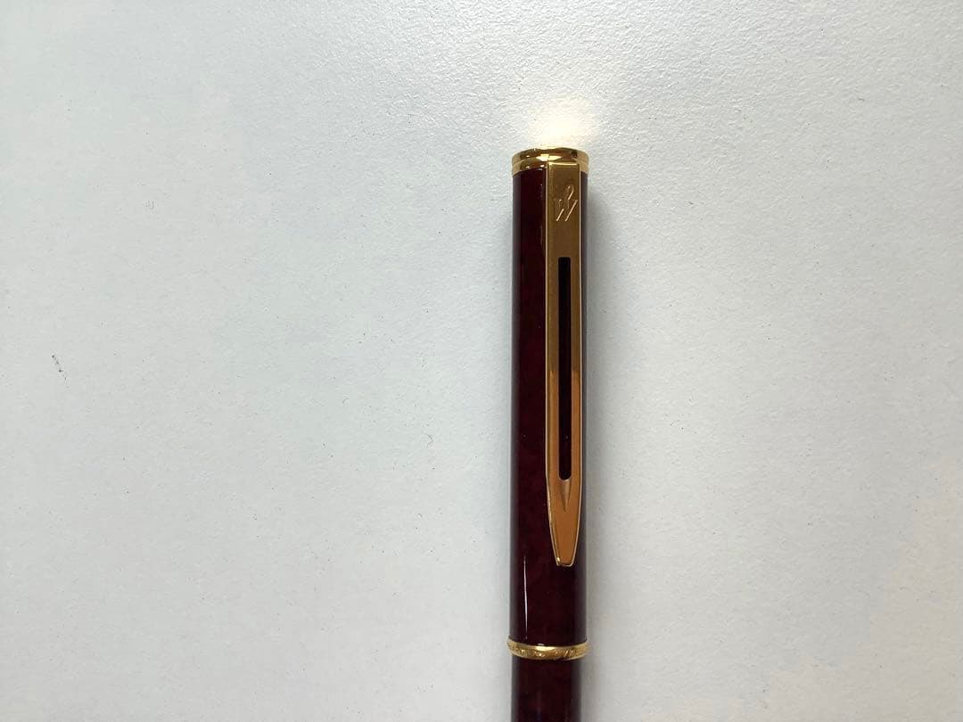 Used Waterman ballpoint pen without ink cartridge displayed on white background